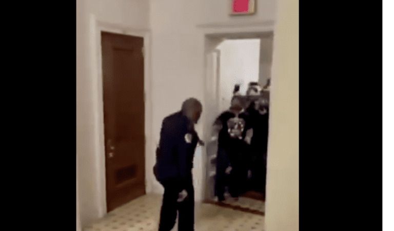 WATCH: As A ‘Protestor” Wearing All Black Makes His Way Through Capitol Building With The Help Of A Police Officer, Antifa Again?