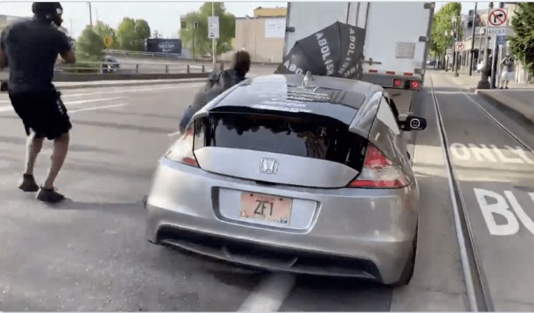 WATCH: “Abolish the Police” Protester Blocks Road, Gets Hit By Car, Wishes Police Were There