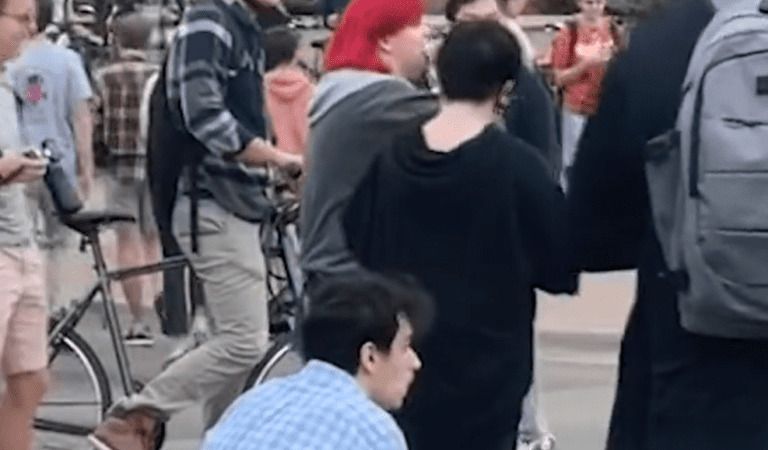 Leftist Rips Apart Bible And Eats It At Transgender Protest